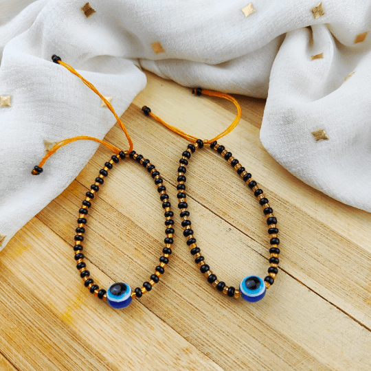 Adjustable Evil Eye Gold Black Beads Nazaria Bracelet for kids, featuring dark beads and protective evil eye charms.