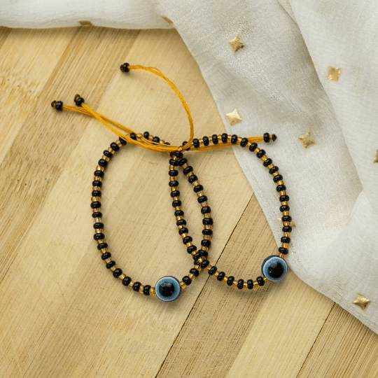 Adjustable Evil Eye Gold Black Beads Nazaria Bracelet for kids, featuring dark beads and protective evil eye charms.