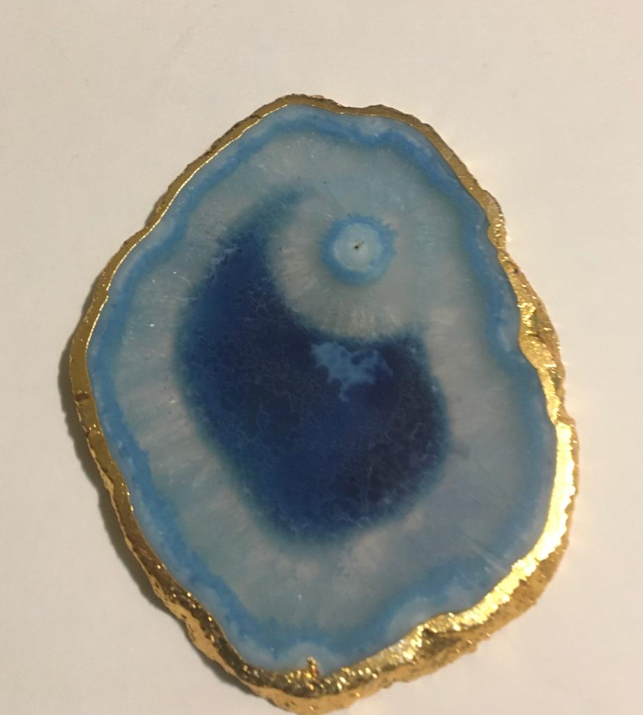 Set of hand-polished blue agate coasters with unique patterns and gilded golden edges, perfect for home decor.