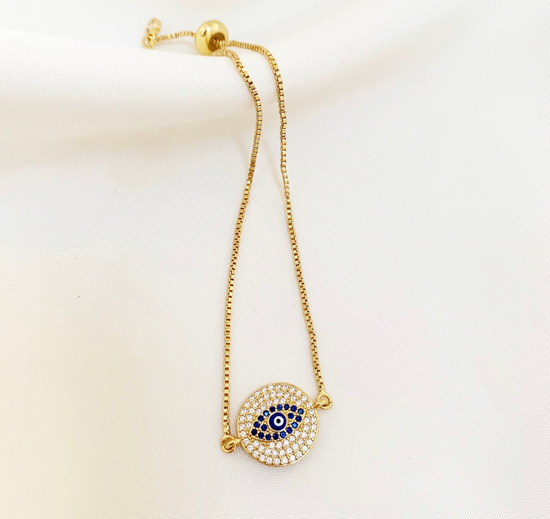 AMARA Bracelet featuring an adjustable bolo design with a colorful cubic zirconia evil eye charm, elegantly crafted in 18K gold plated brass.