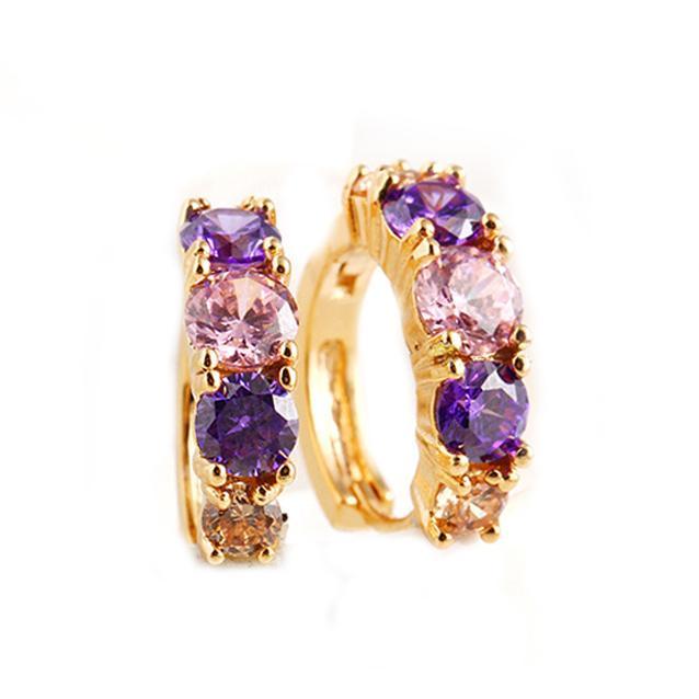 Elegant Amethyst Multistone Huggie Earrings featuring Austrian Crystals, crafted in 18K gold plating, showcasing a luxurious and stylish design.