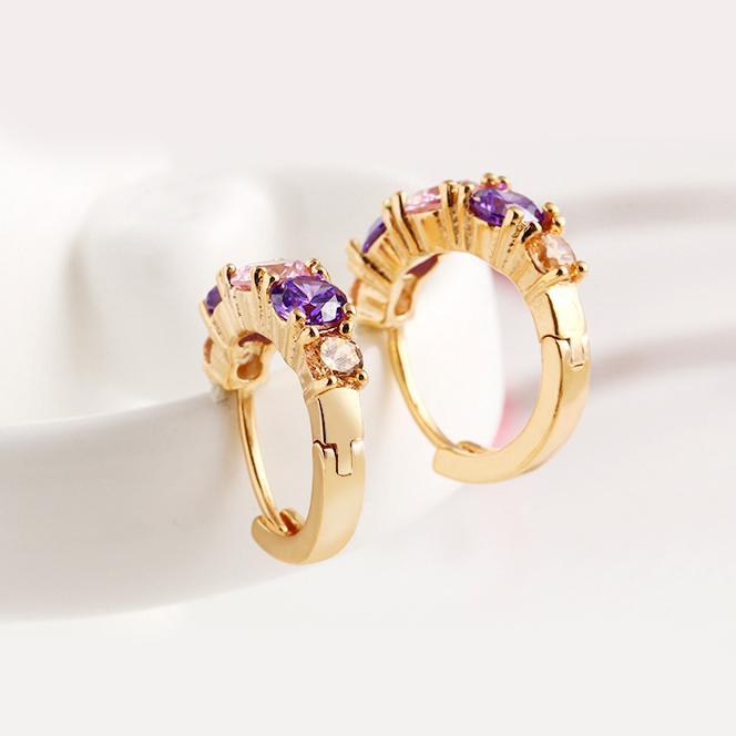 Elegant Amethyst Multistone Huggie Earrings featuring Austrian Crystals, crafted in 18K gold plating, showcasing a luxurious and stylish design.