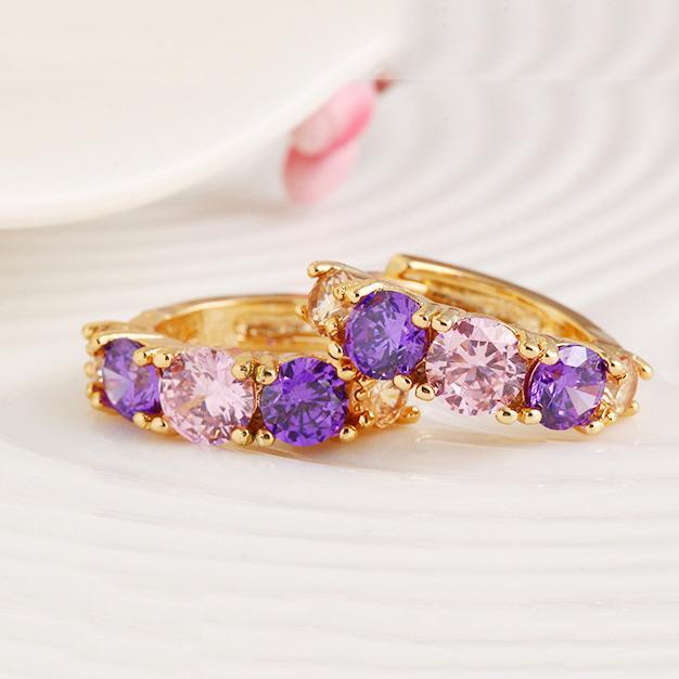 Elegant Amethyst Multistone Huggie Earrings featuring Austrian Crystals, crafted in 18K gold plating, showcasing a luxurious and stylish design.