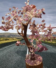 Amethyst Tree made of natural amethyst gemstone chips on a wooden base, showcasing its elegant purple hues and intricate design.