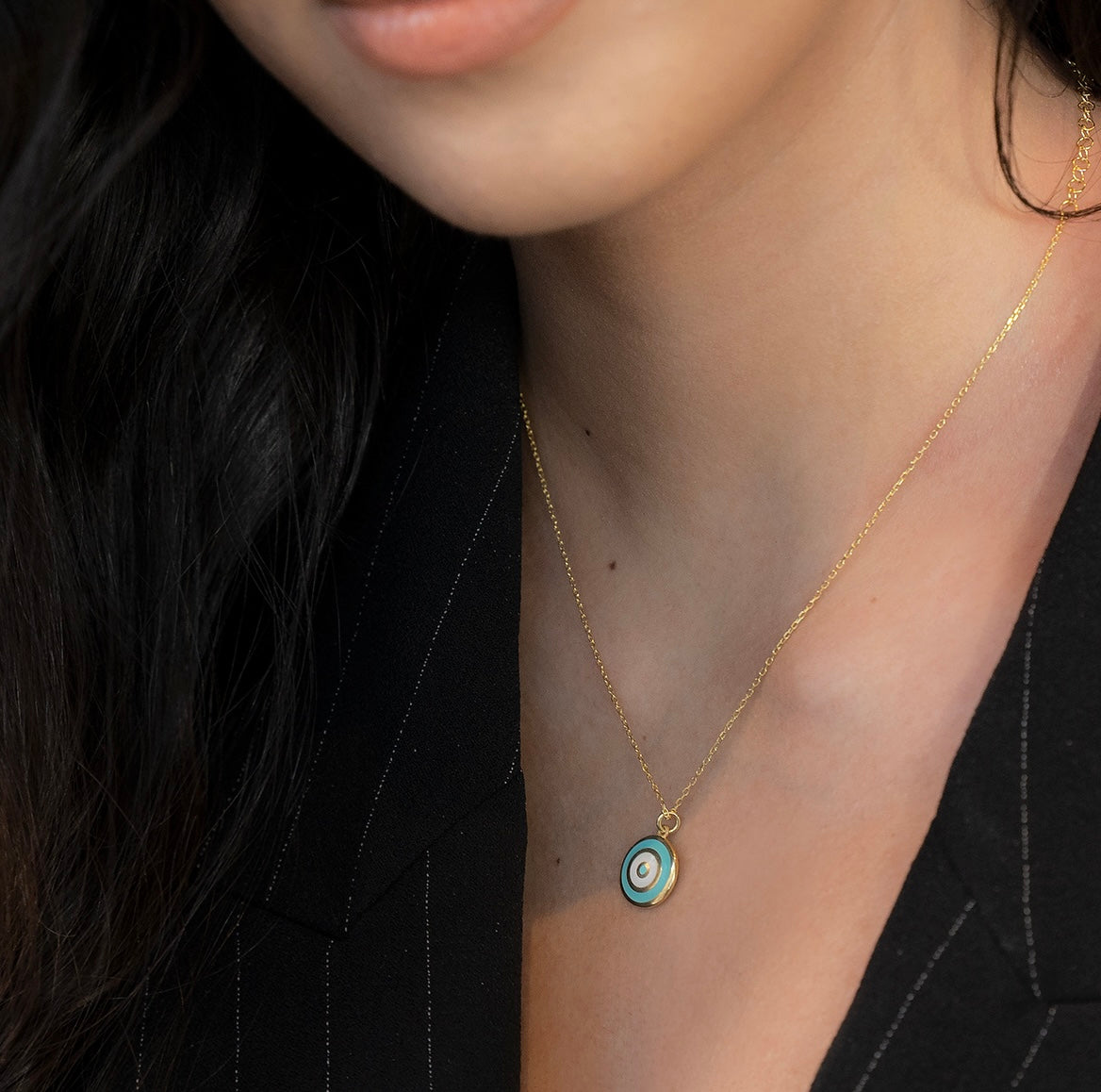 The ANOUSH Necklace featuring aquamarine and cream-white enamel, elegantly designed in yellow gold plated 925 sterling silver.