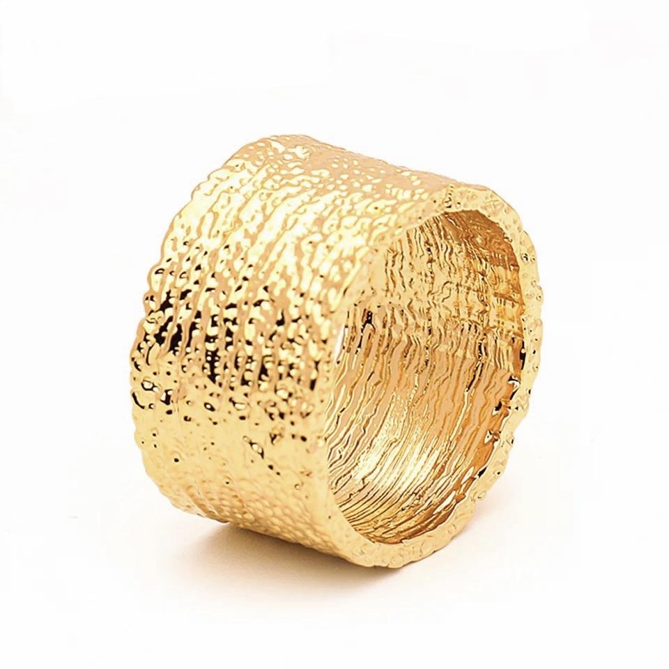 Elegant April Band Ring made of thin hammered 18k plated stainless steel, showcasing a modern design.