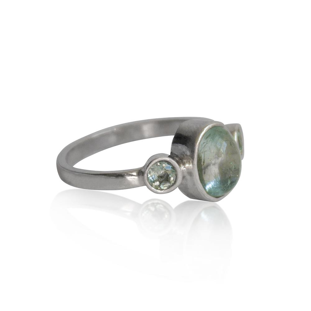 Aquamarine Bezel and Tube Sterling Silver Ring featuring an oval aquamarine and two round aquamarine stones, handcrafted in the USA.