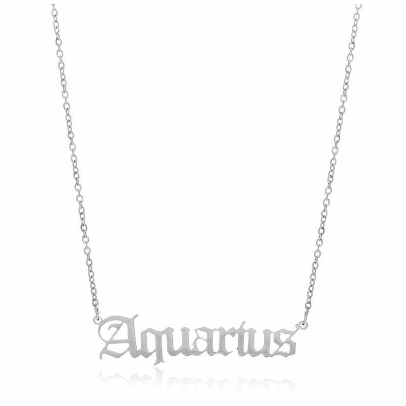 Aquarius Zodiac Necklace in gold and silver, crafted from stainless steel, showcasing a celestial design.