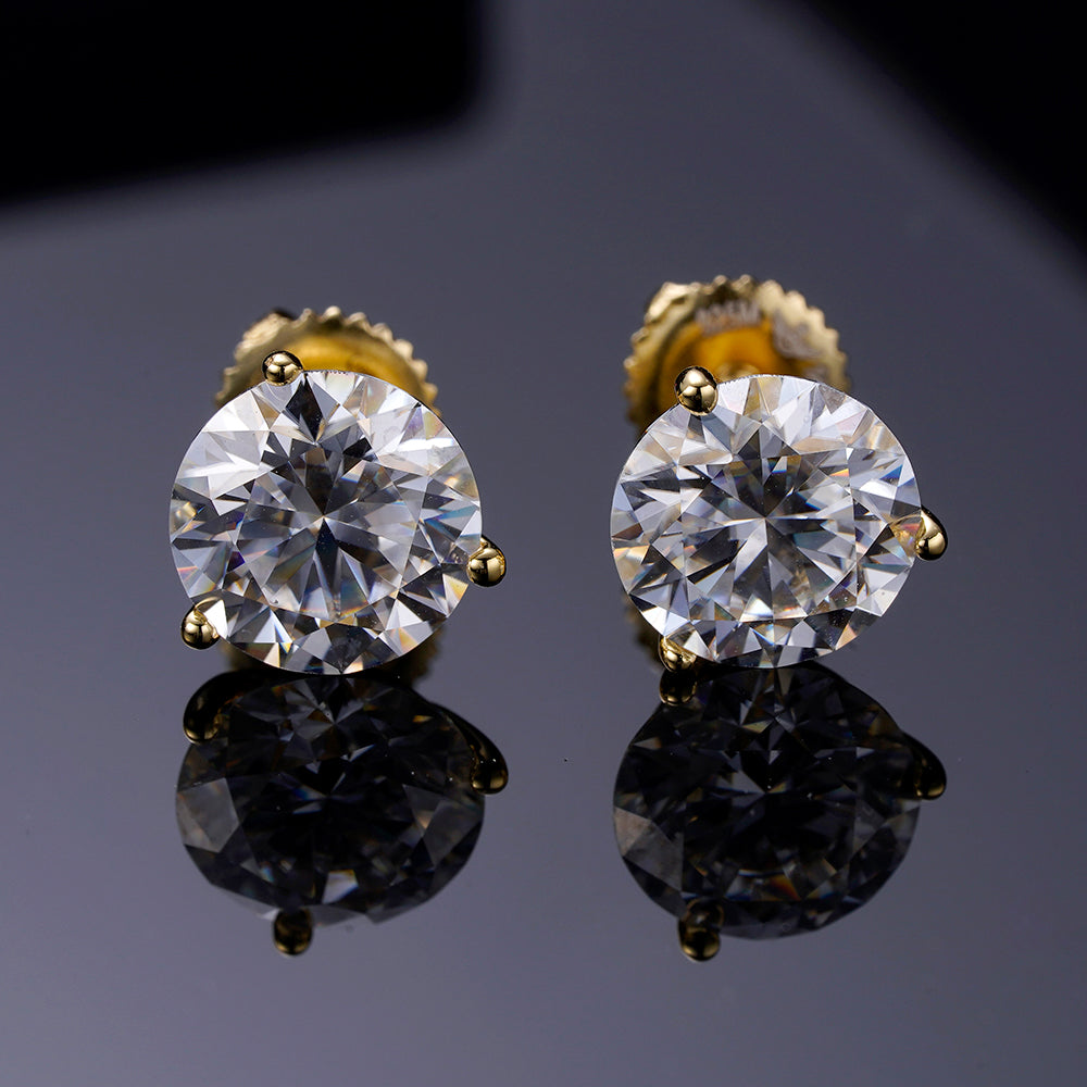 A pair of elegant ARGENTUM 925 Moissanite Earrings in a gold color setting, showcasing their brilliant sparkle and minimalistic design.
