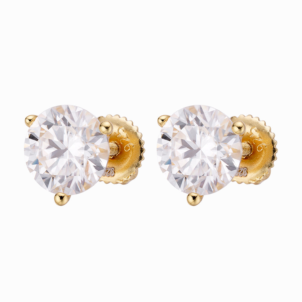 A pair of elegant ARGENTUM 925 Moissanite Earrings in a gold color setting, showcasing their brilliant sparkle and minimalistic design.