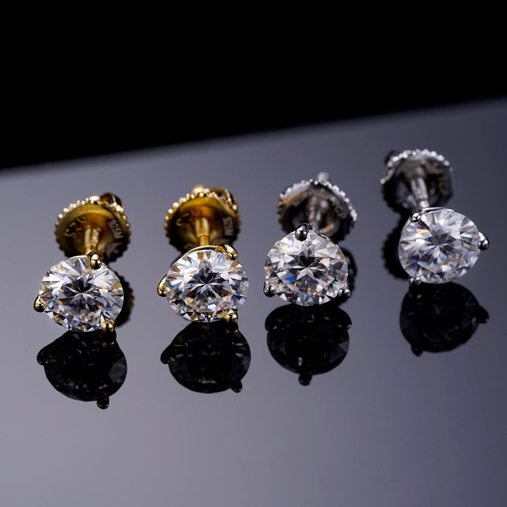 A pair of elegant ARGENTUM 925 Moissanite Earrings in a gold color setting, showcasing their brilliant sparkle and minimalistic design.