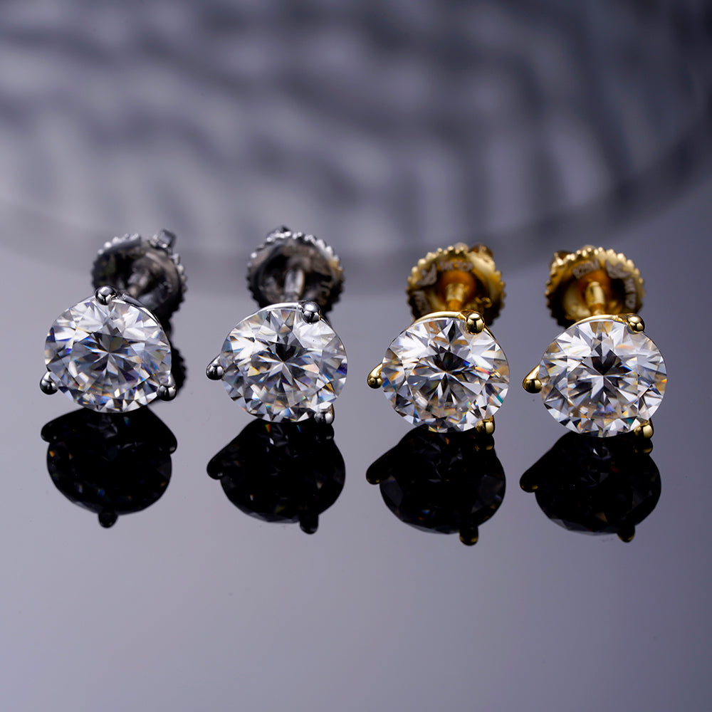 A pair of elegant ARGENTUM 925 Moissanite Earrings in a gold color setting, showcasing their brilliant sparkle and minimalistic design.