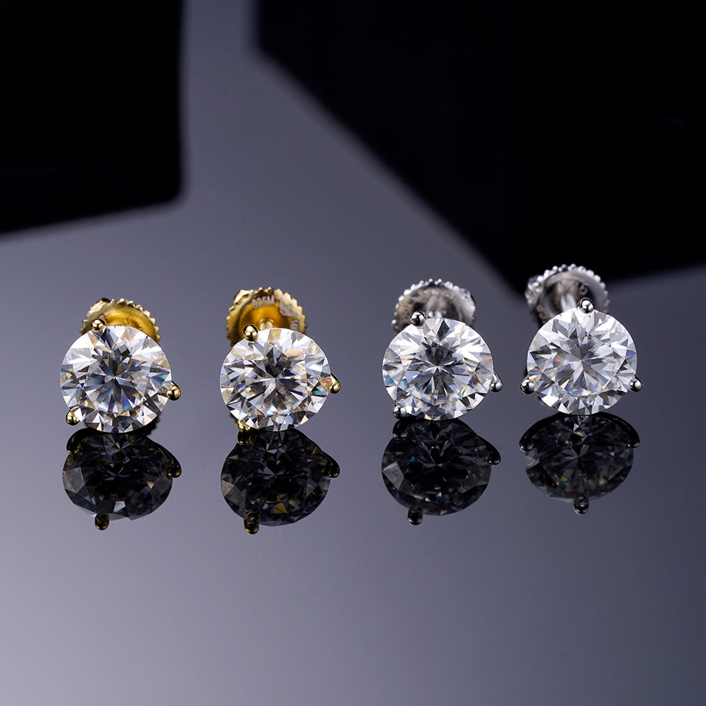 A pair of elegant ARGENTUM 925 Moissanite Earrings in a gold color setting, showcasing their brilliant sparkle and minimalistic design.