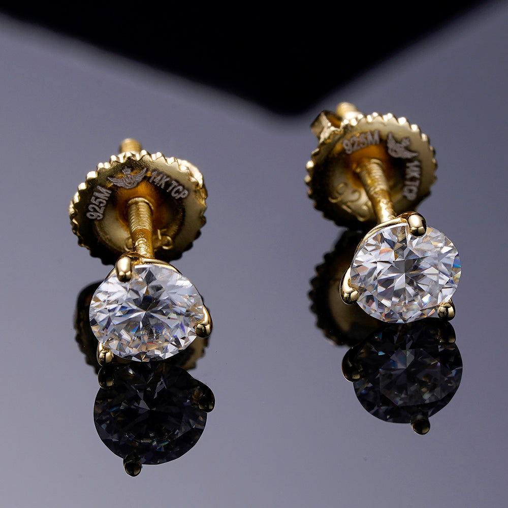 A pair of elegant ARGENTUM 925 Moissanite Earrings in a gold color setting, showcasing their brilliant sparkle and minimalistic design.