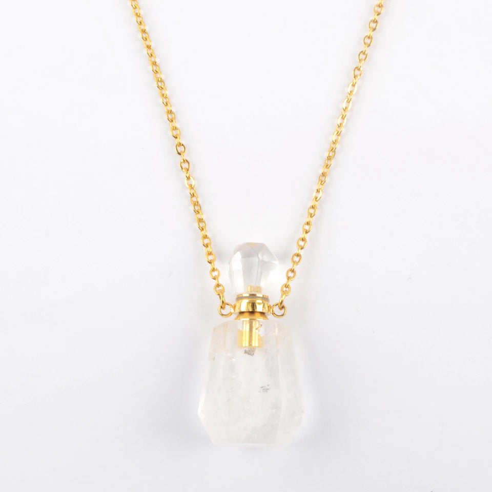 Aroma Gem Necklace featuring a gold plated chain and a crystal pendant designed for essential oil infusion.