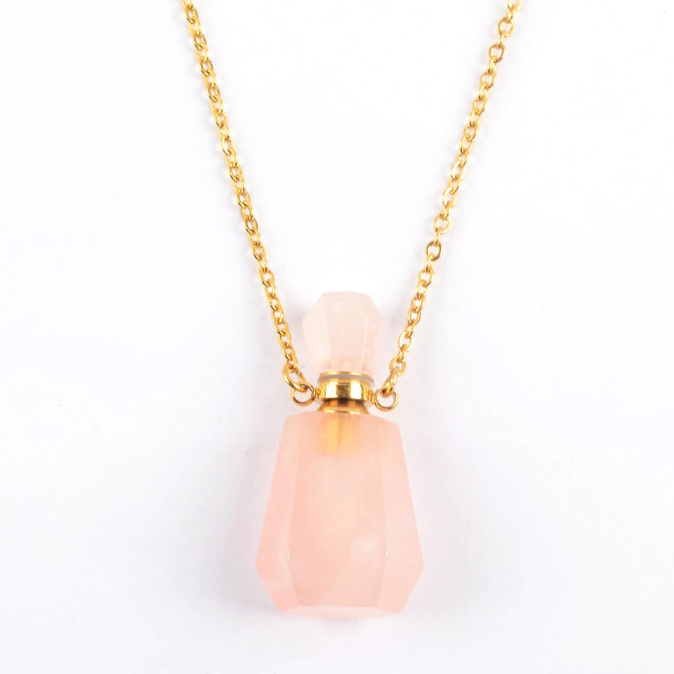 Aroma Gem Necklace featuring a gold plated chain and a crystal pendant designed for essential oil infusion.