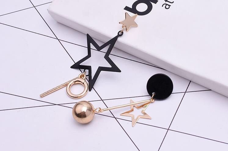 Asymmetric Black Gold Star Slinky Earrings showcasing a unique design with elegant black and gold colors, perfect for any occasion.
