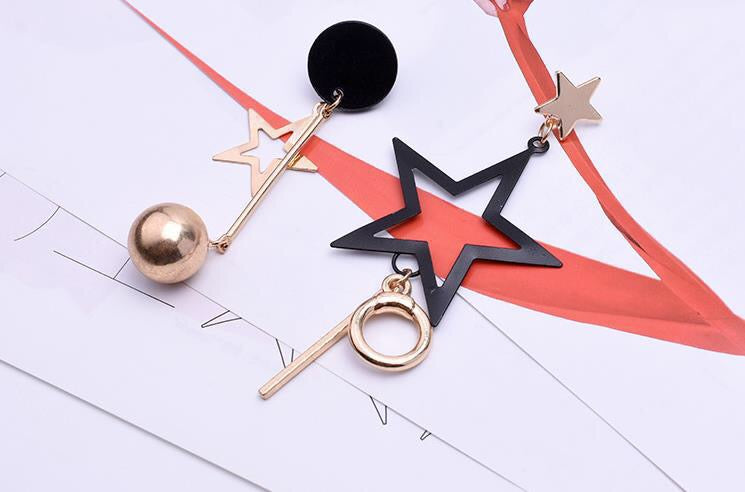 Asymmetric Black Gold Star Slinky Earrings showcasing a unique design with elegant black and gold colors, perfect for any occasion.