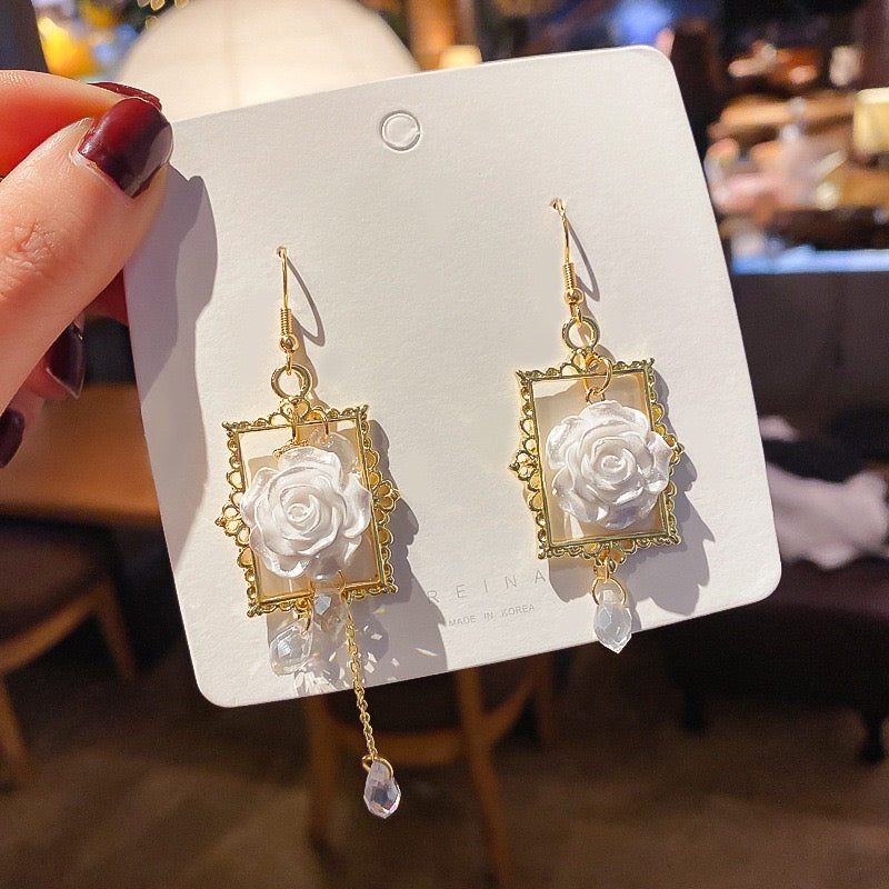 Asymmetric earrings featuring a rose in a photo frame with pearl tassels, crafted from alloy and S925 silver.