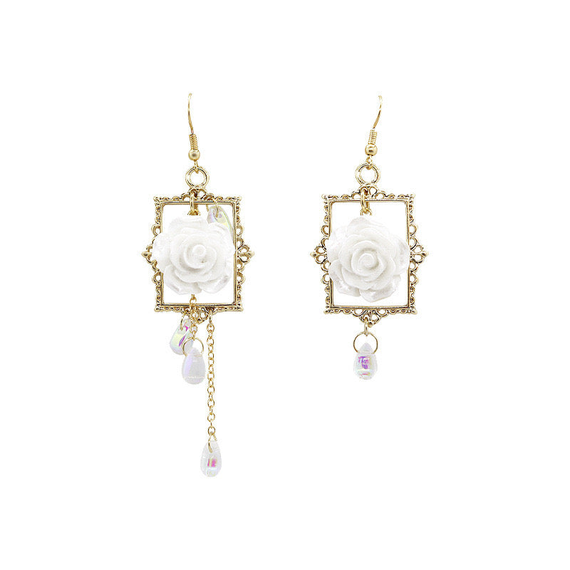 Asymmetric earrings featuring a rose in a photo frame with pearl tassels, crafted from alloy and S925 silver.