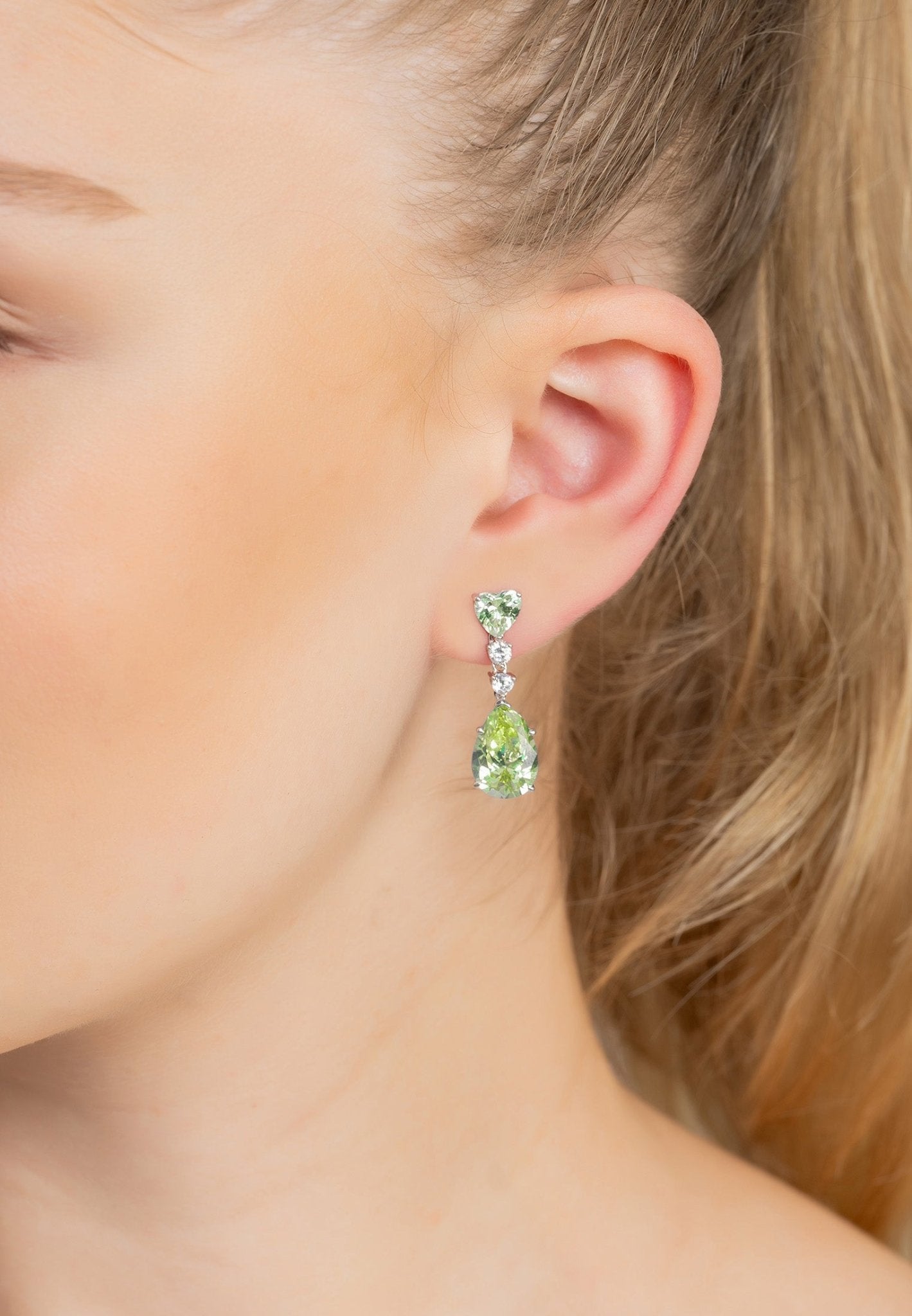 Augusta Peridot Teardrop Earrings in silver featuring lab-created petrol tourmaline and simulated diamonds, elegantly designed for luxury.