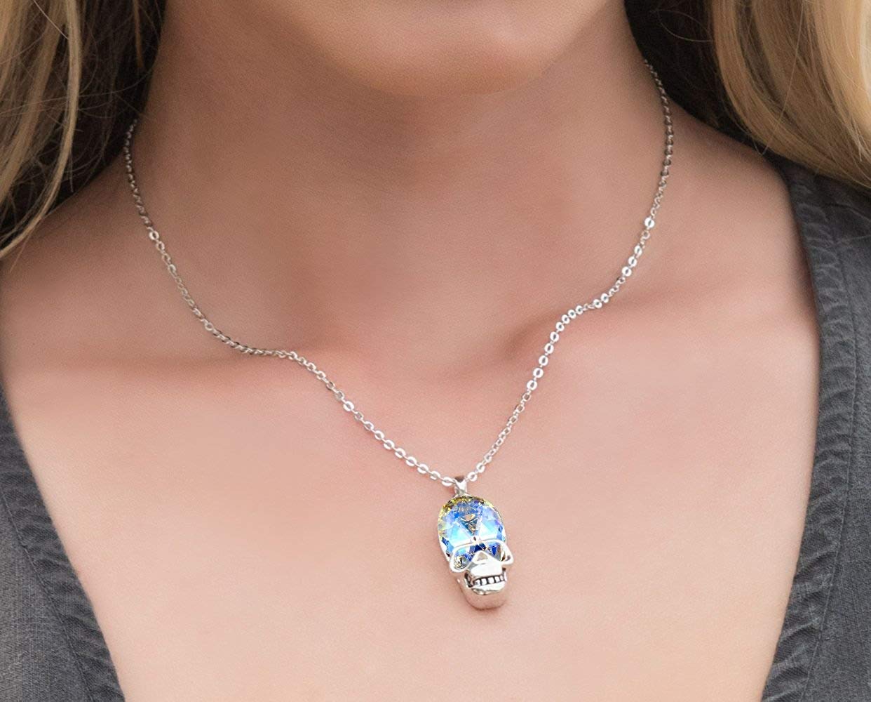 Aurora Borealis Skull Pendant Necklace featuring 14K white gold plating and an oval AAAAA crystal, elegantly designed for unique style.