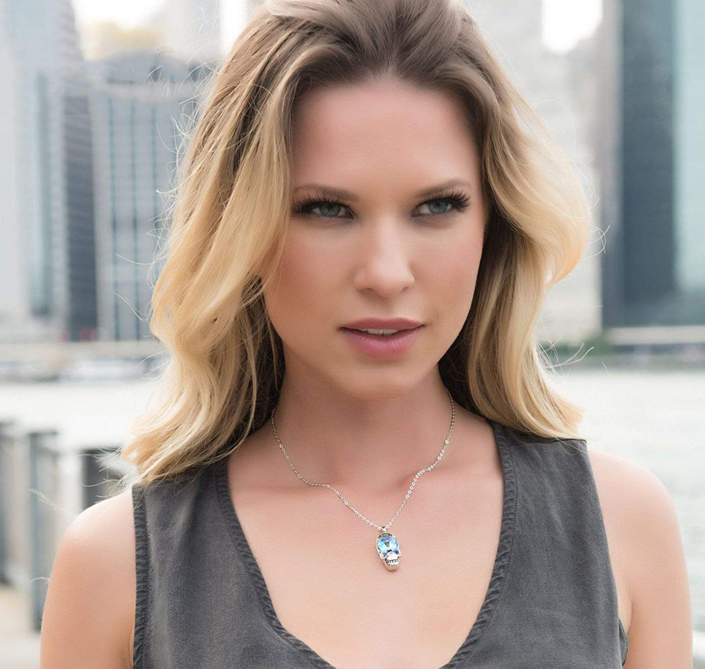 Aurora Borealis Skull Pendant Necklace featuring 14K white gold plating and an oval AAAAA crystal, elegantly designed for unique style.