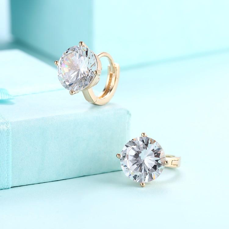 Austrian Crystal Huggies Set in 18K White Gold, showcasing elegant design and sparkling crystals.