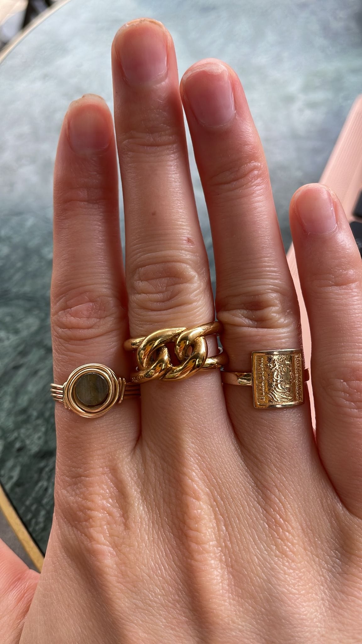 Bailey Intertwined Knot Ring in 18Kt yellow gold, showcasing its sleek design and durable stainless steel construction.