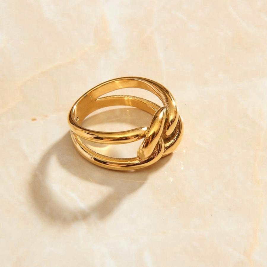 Bailey Intertwined Knot Ring in 18Kt yellow gold, showcasing its sleek design and durable stainless steel construction.