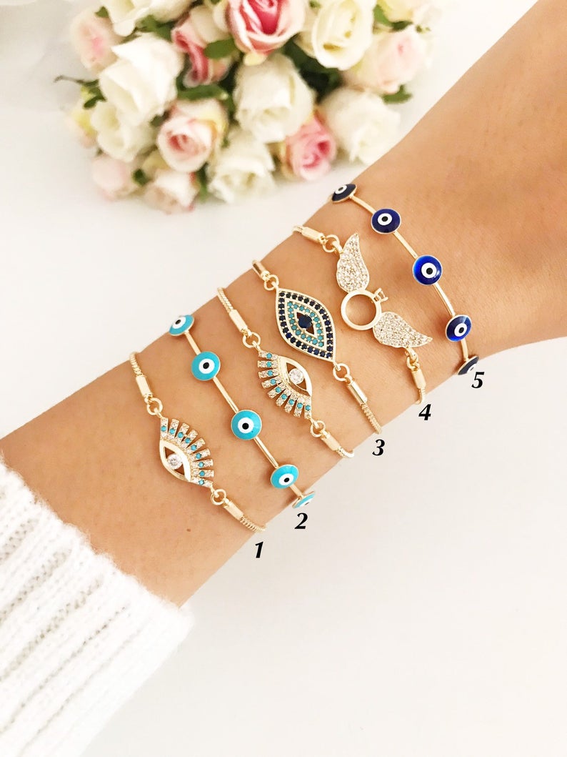 Gold adjustable Bangle Evil Eye Bracelet featuring a turquoise charm and zircon accents, handmade from tarnish-resistant stainless steel.