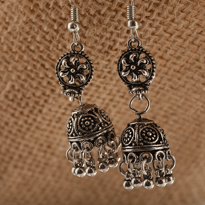 Baroque engraved bell earrings with tassel detail, showcasing intricate design and lightweight alloy material.