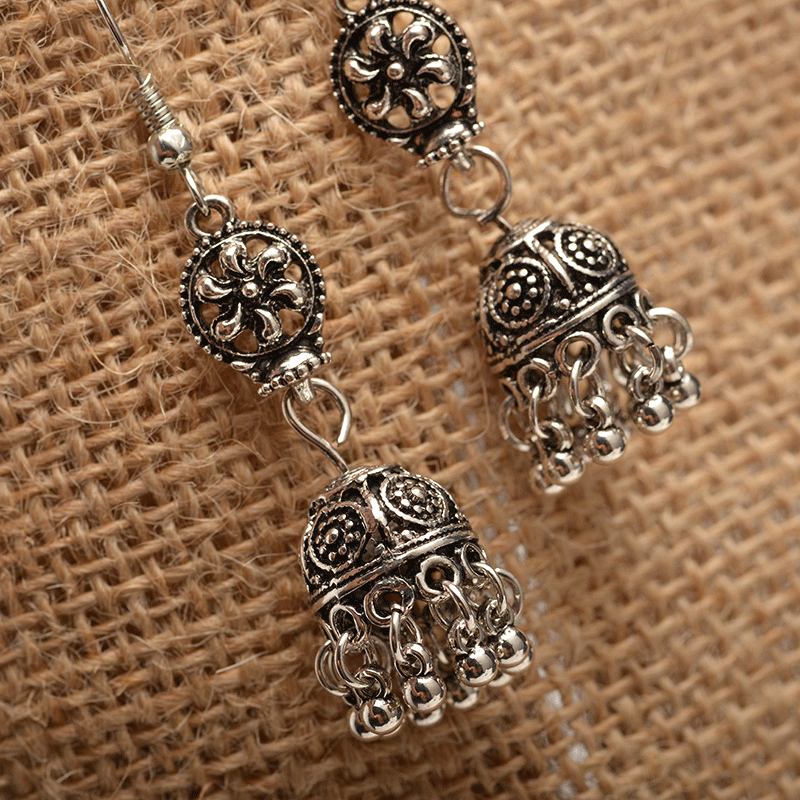 Baroque engraved bell earrings with tassel detail, showcasing intricate design and lightweight alloy material.