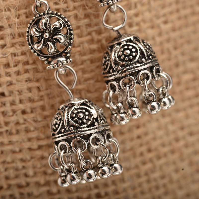 Baroque engraved bell earrings with tassel detail, showcasing intricate design and lightweight alloy material.