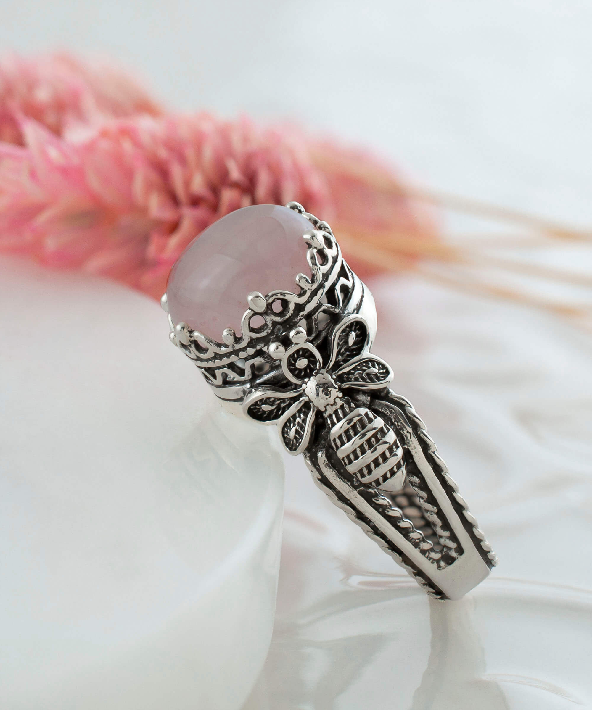 Elegant Bee Detailed Rose Quartz Gemstone Filigree Art Cocktail Ring in sterling silver with a pink cabochon gemstone.