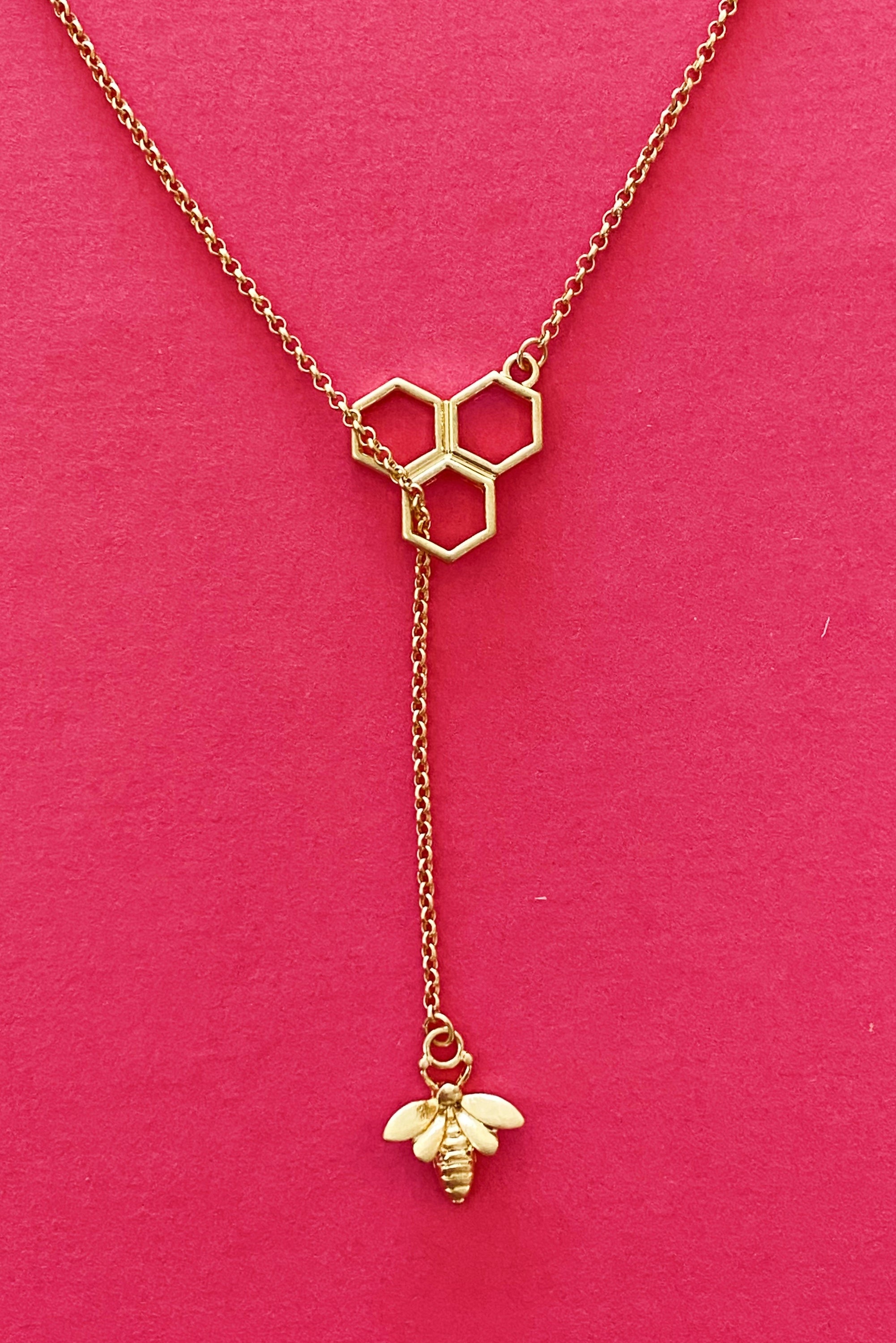 Gold Bee With Me Necklace featuring a bee hive design with a bumble bee charm, adjustable length with a 3-inch extender.