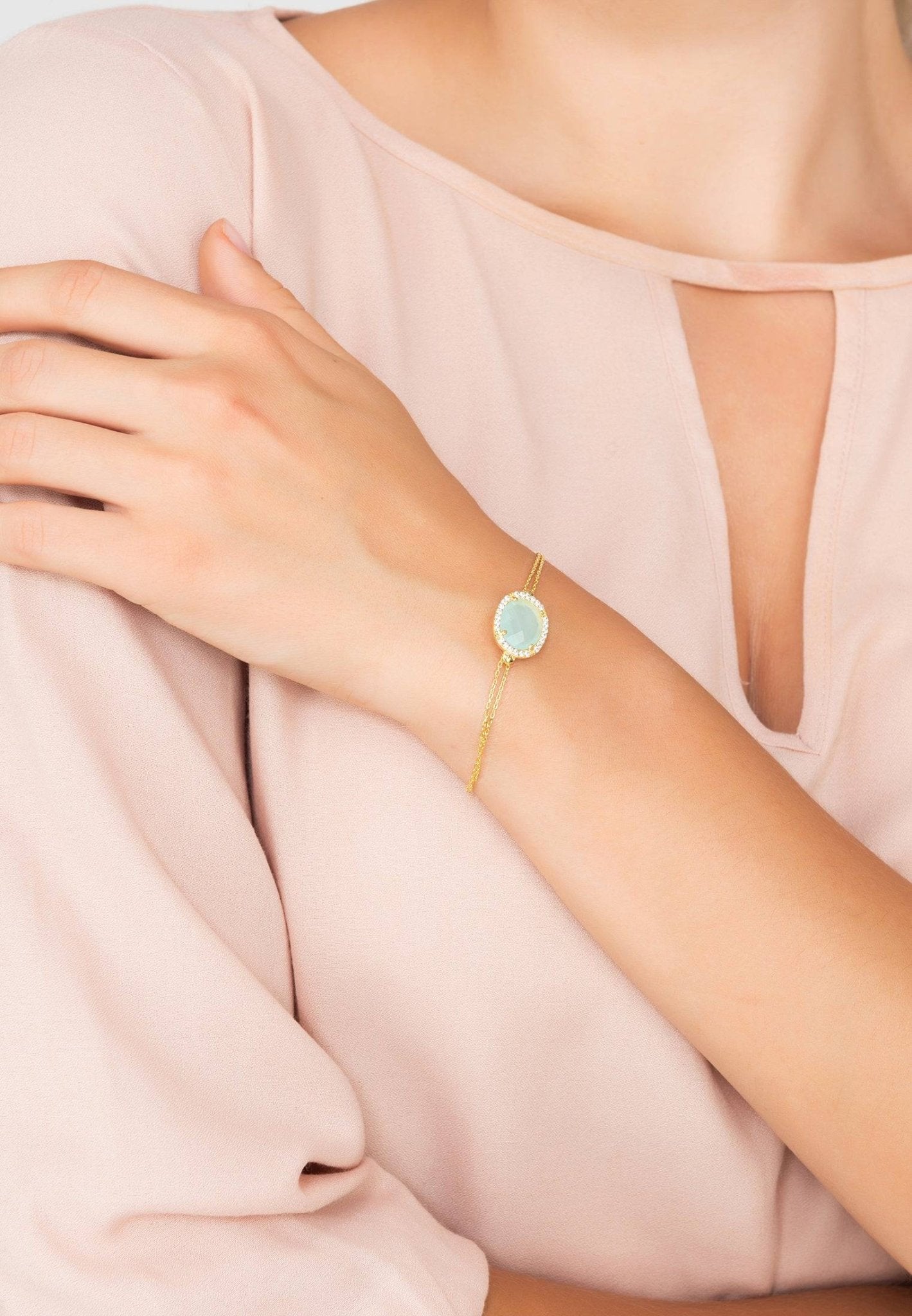 Beatrice Oval Gemstone Bracelet featuring aqua chalcedony and cubic zirconia on a gold-dipped sterling silver chain.
