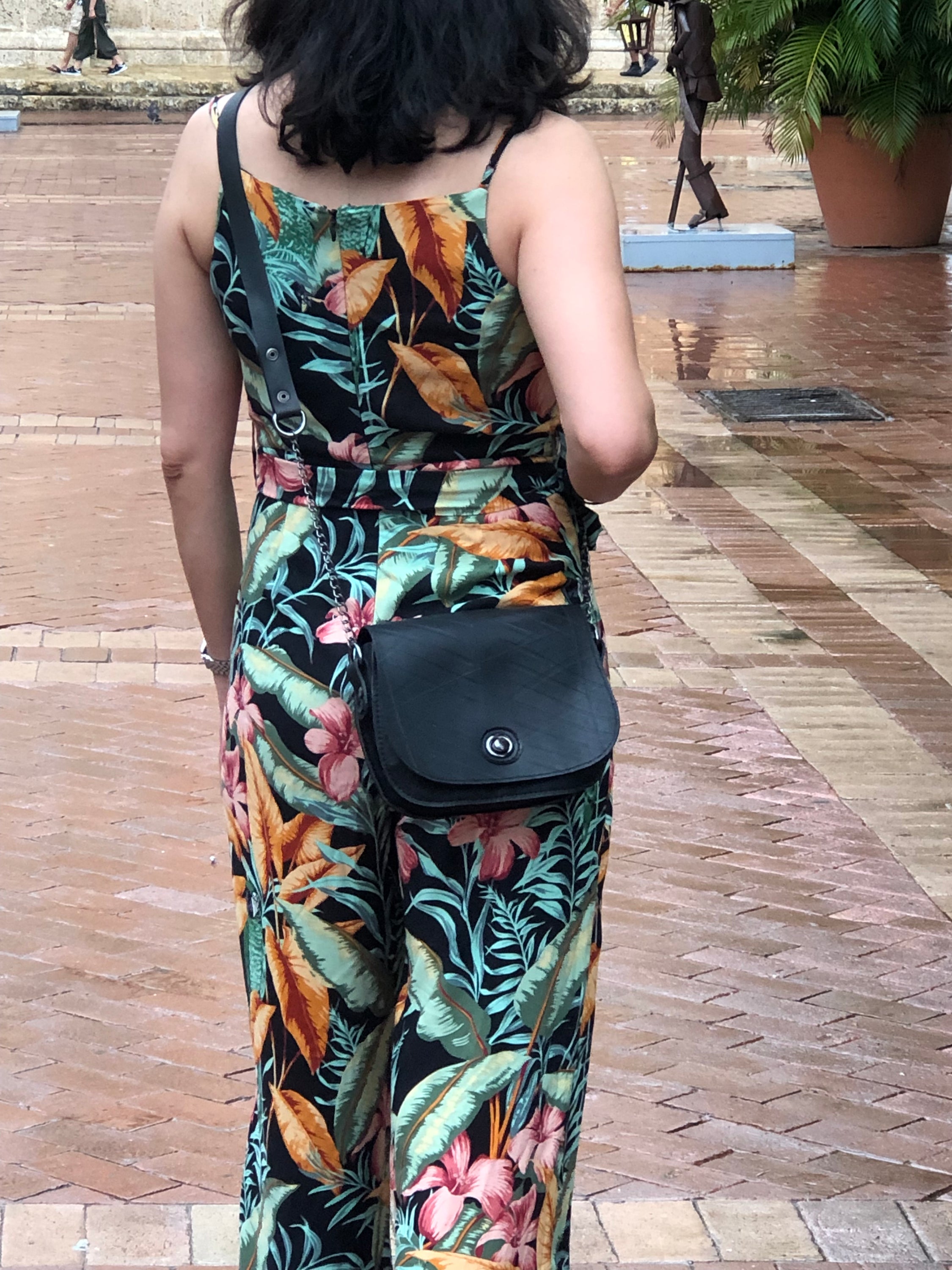 Becca Classic Black Vegan Saddle Bag made from recycled inner tubes, featuring unique patterns and grey velvet lining.