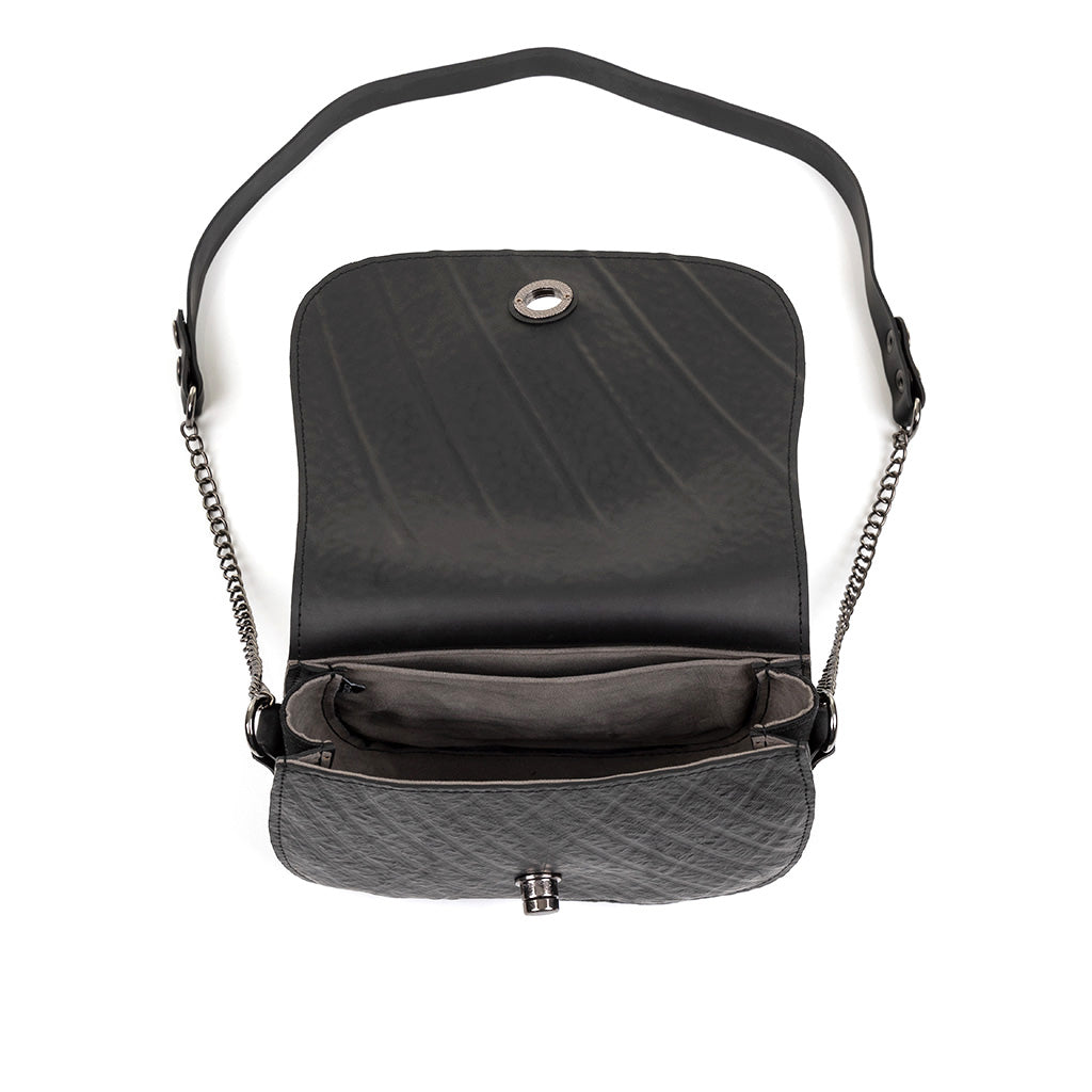 Becca Classic Black Vegan Saddle Bag made from recycled inner tubes, featuring unique patterns and grey velvet lining.
