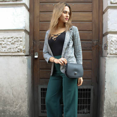 Becca Classic Black Vegan Saddle Bag made from recycled inner tubes, featuring unique patterns and grey velvet lining.