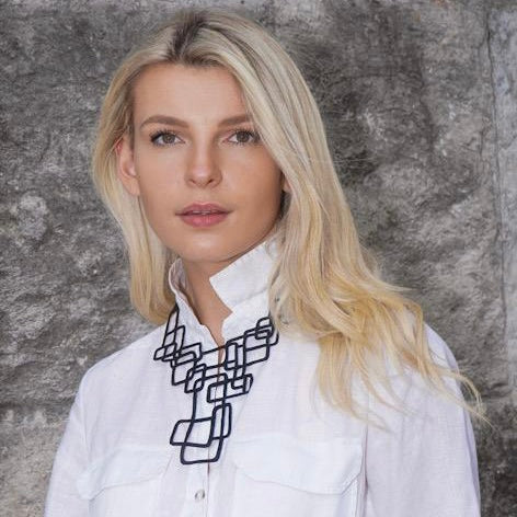 Belinda Statement Rubber Necklace made from recycled tyre inner tubes, featuring a unique abstract design and lightweight construction.