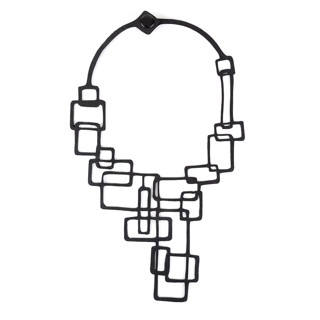 Belinda Statement Rubber Necklace made from recycled tyre inner tubes, featuring a unique abstract design and lightweight construction.