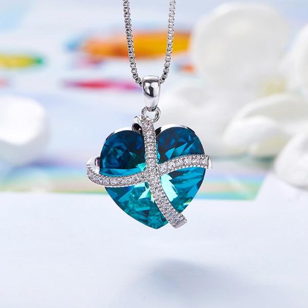 Bermuda Blue Sleek Heart Pav'e Lining Necklace in 14K White Gold featuring a heart-shaped blue pendant and link chain.