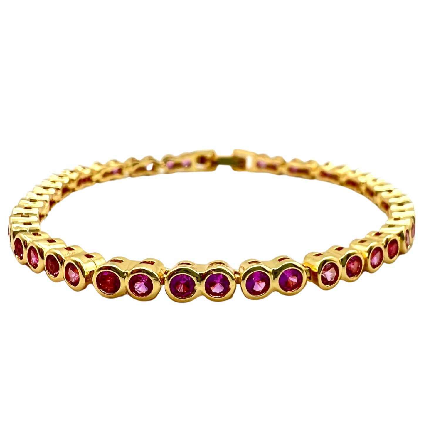 A beautiful pink Bezel Tennis Bracelet featuring sparkling cubic zirconia stones set in a sleek design, perfect for stacking.