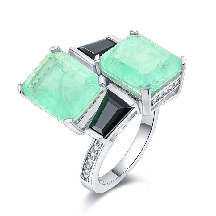 Elegant Black Baguette and See Blue Paraiba Fancy Ring in 925 sterling silver with white gold finish, showcasing vibrant stones.