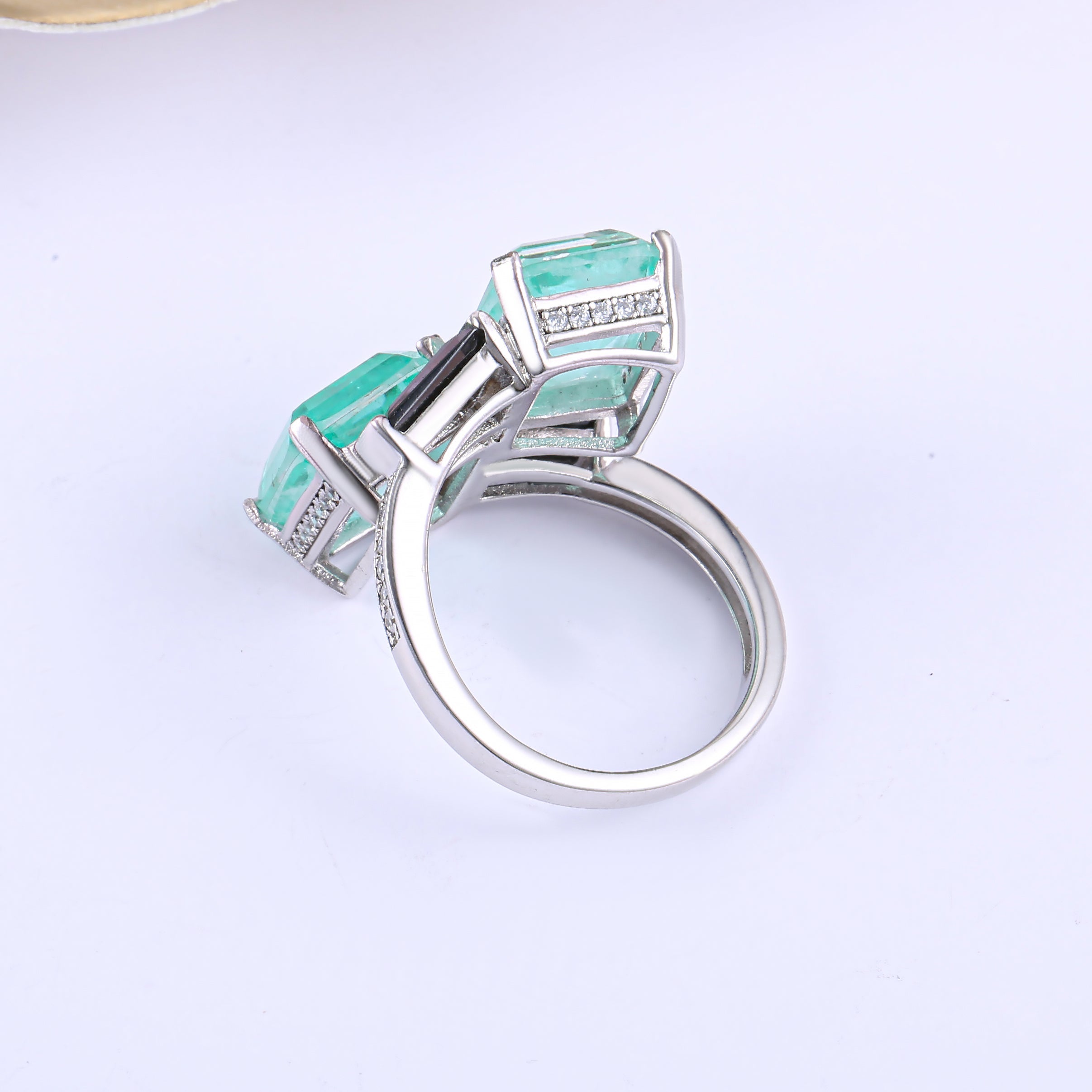 Elegant Black Baguette and See Blue Paraiba Fancy Ring in 925 sterling silver with white gold finish, showcasing vibrant stones.