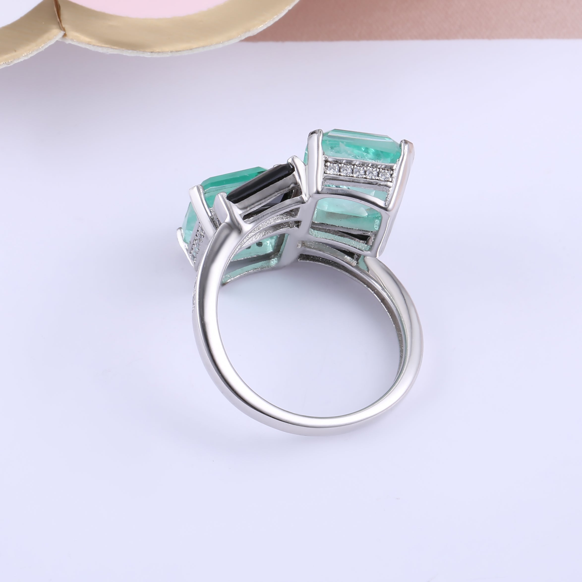 Elegant Black Baguette and See Blue Paraiba Fancy Ring in 925 sterling silver with white gold finish, showcasing vibrant stones.