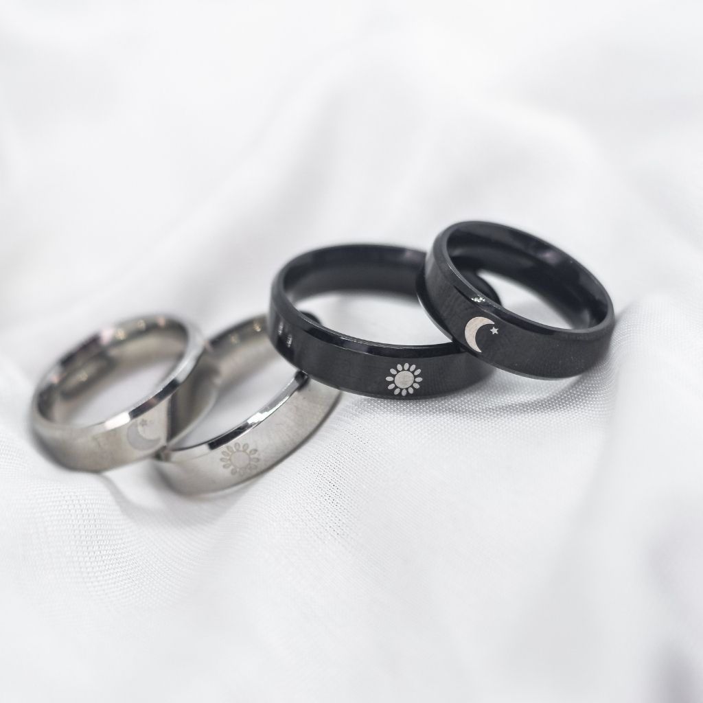 Black Band Matching Couple Moon and Sun Promise Ring set showcasing elegant sun and moon designs on durable black bands.