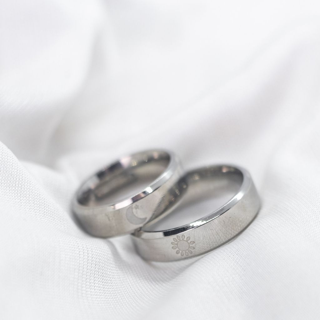 Black Band Matching Couple Moon and Sun Promise Ring set showcasing elegant sun and moon designs on durable black bands.