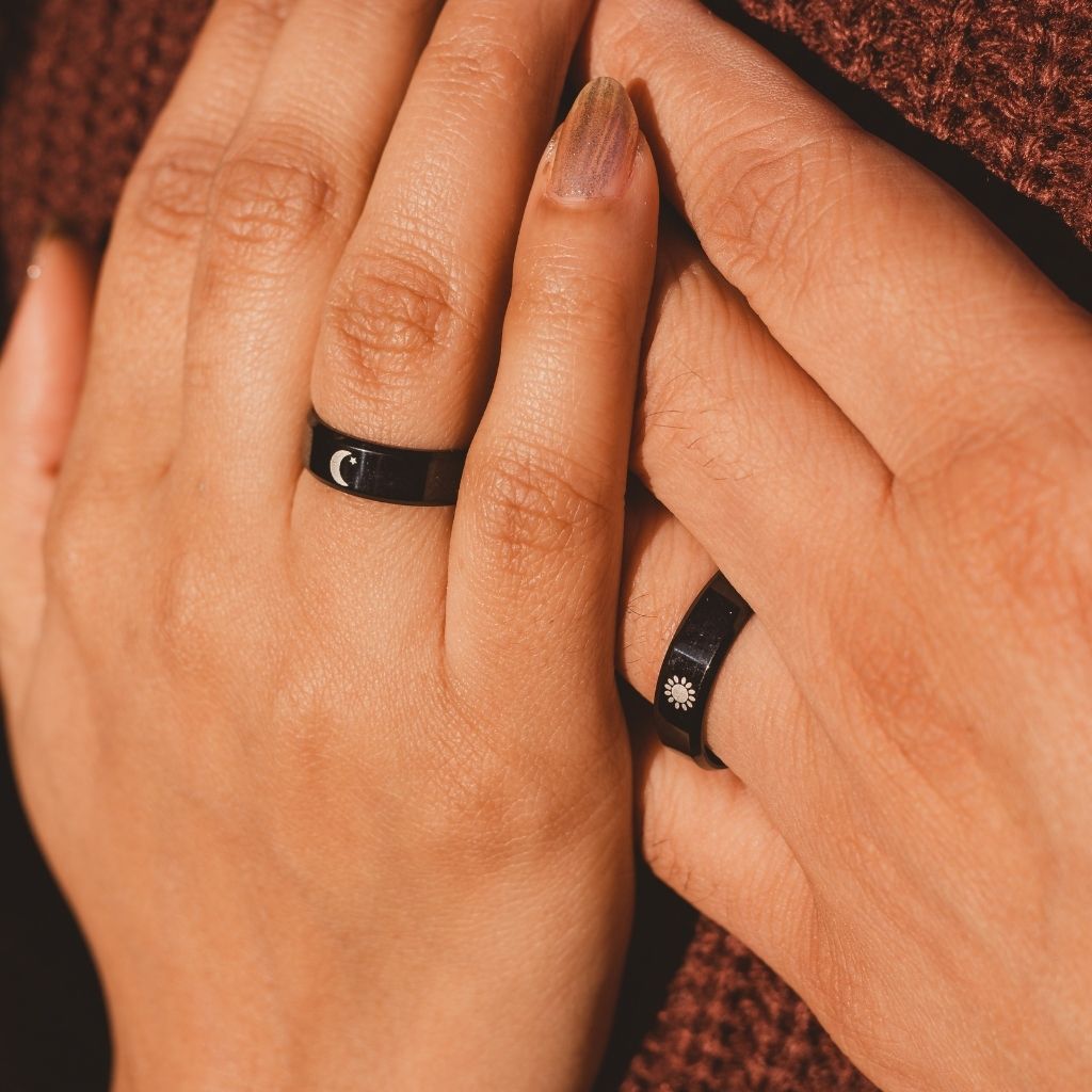 Black Band Matching Couple Moon and Sun Promise Ring set showcasing elegant sun and moon designs on durable black bands.